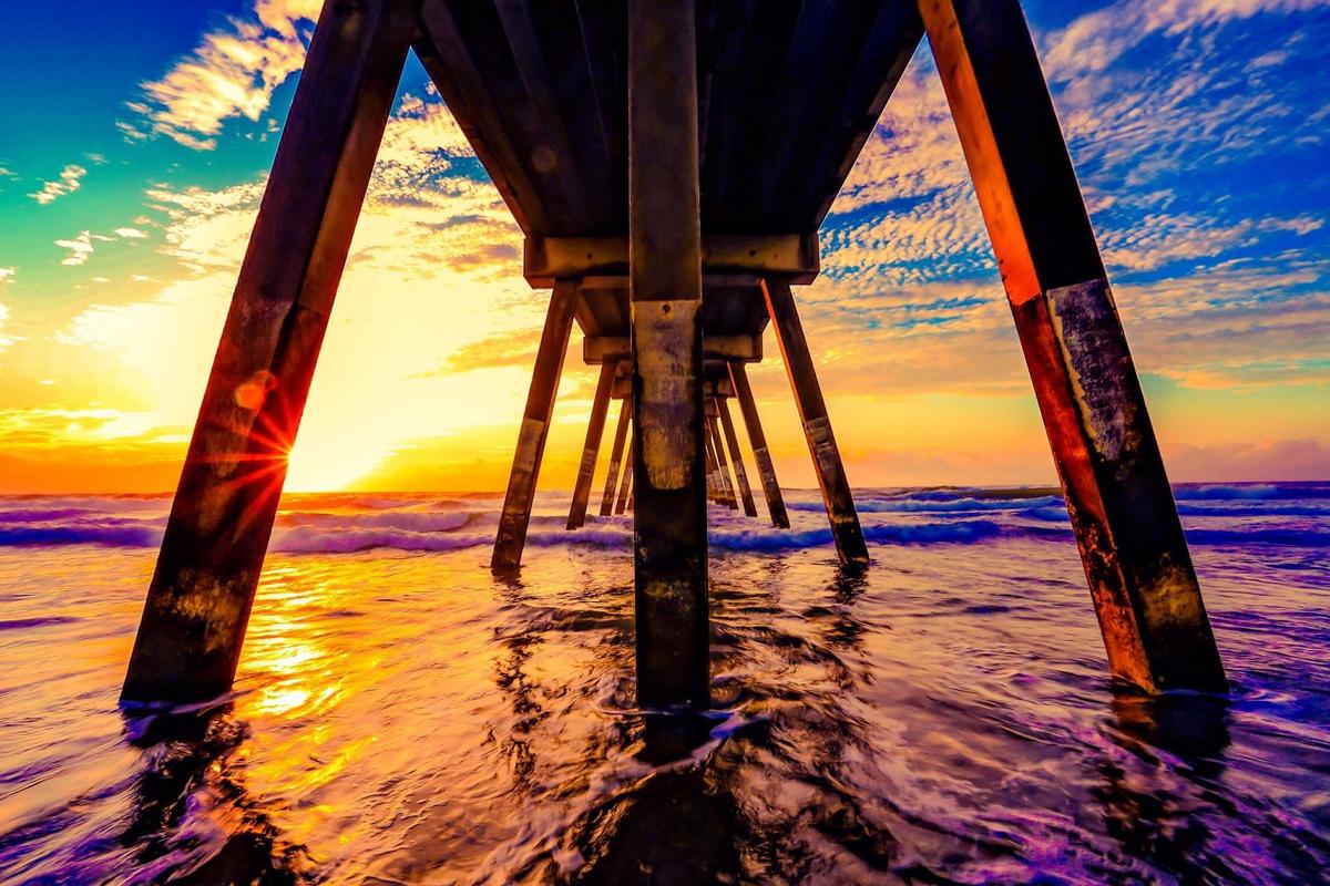 Salle de soin tamisée de l'institut Nocturnemist Glen, bougies et pierres chaudes